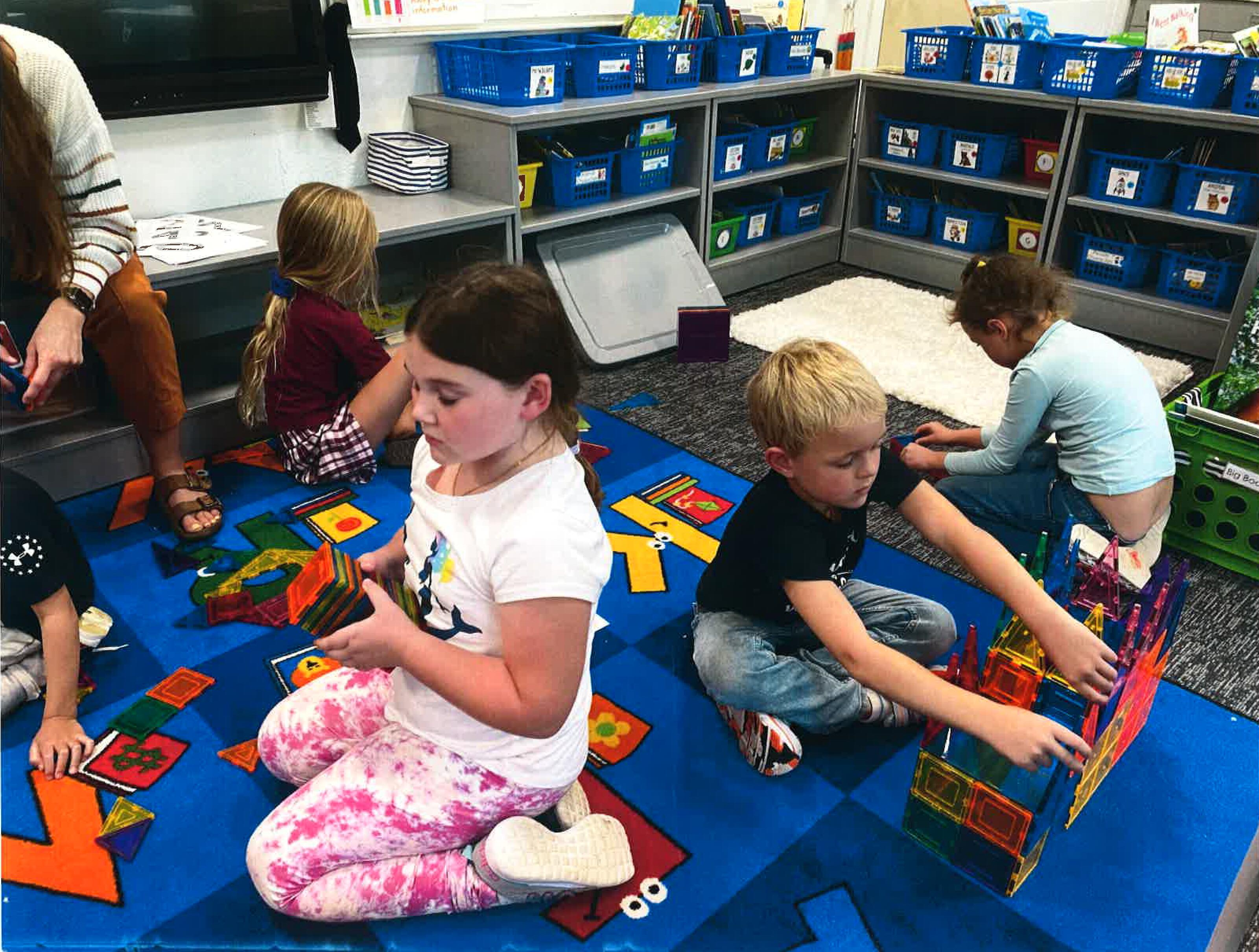 Students with magnatiles