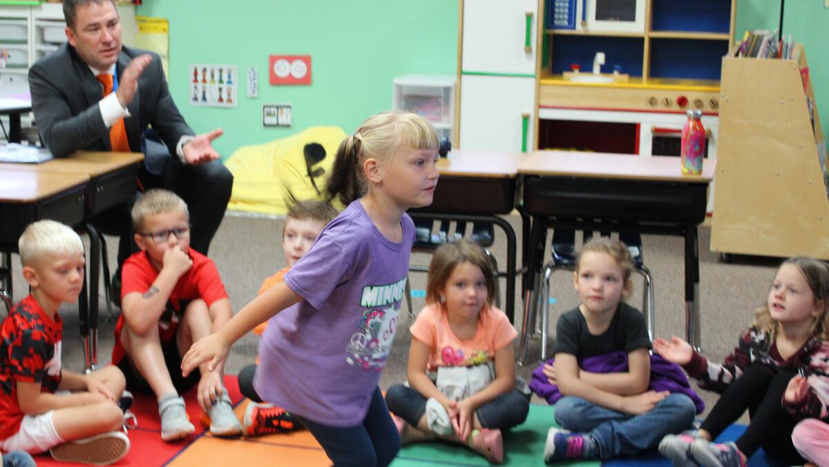 Kindergarten student dancing in class