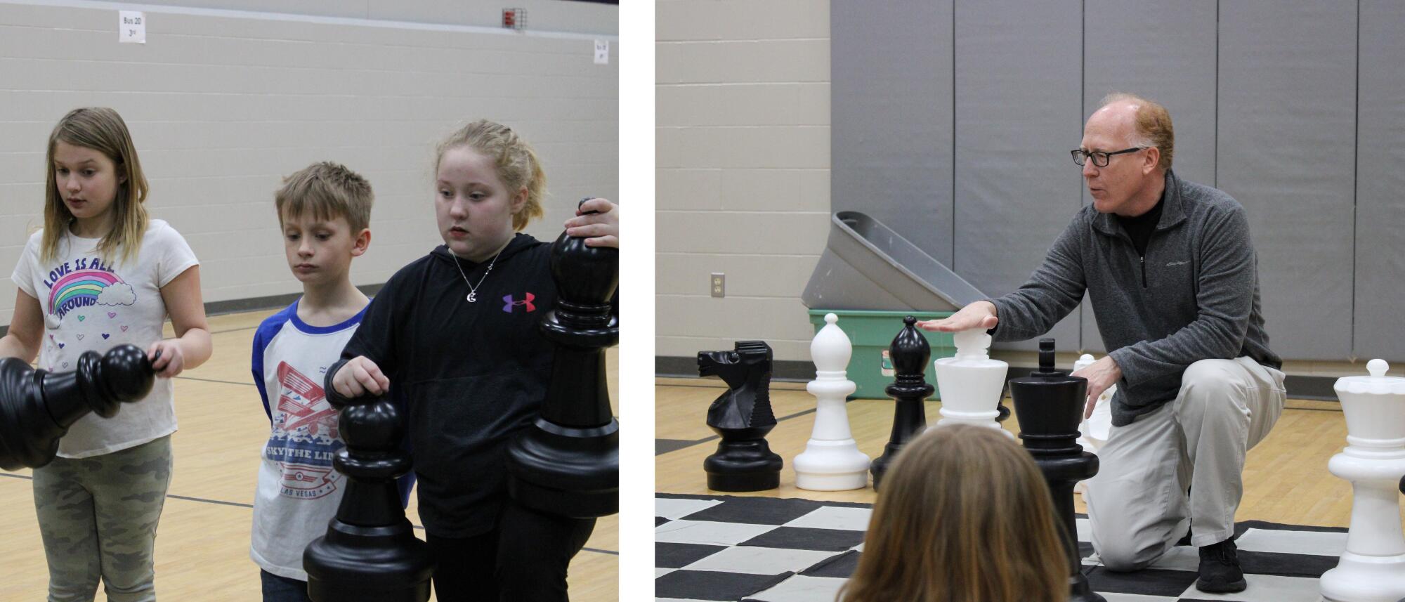 Students listening to "The Chess Guy" Todd Wolf explaining the basic rules of playing chess.